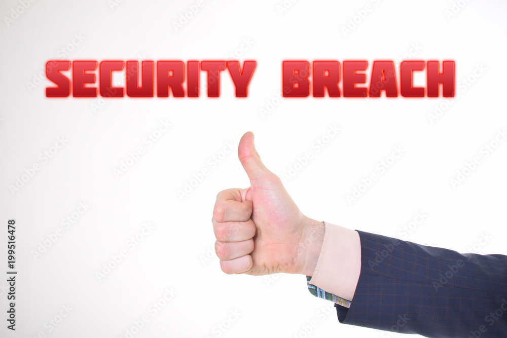 A businessman shows an inscription:SECURITY BREACH A businessman shows an inscription:SECURITY BREACH