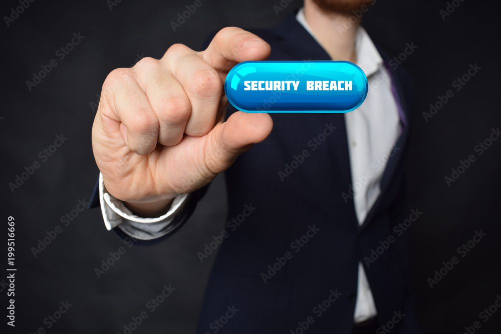 A businessman shows an inscription:SECURITY BREACH A businessman shows an inscription:SECURITY BREACH