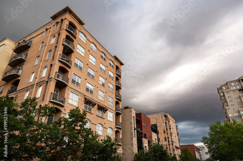 Denver Colorado Apartment Buildings Under Dark Clouds