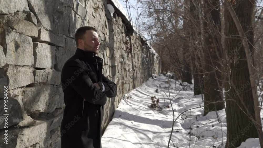 Businessman is standing by the wall Businessman is standing by the wall