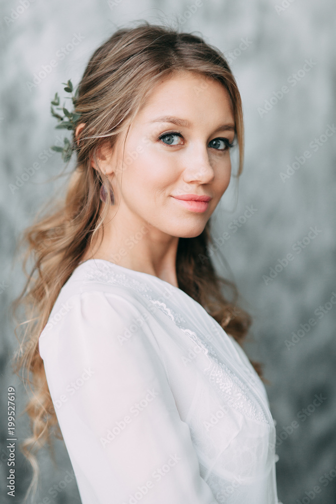 Beautiful young bride in boudoir dress on canvas background with paint. Wedding trends and ideas 2018, spring inspiration. Wedding in the Studio Beautiful young bride in boudoir dress on canvas background with paint. Wedding trends and ideas 2018, spring inspiration. Wedding in the Studio