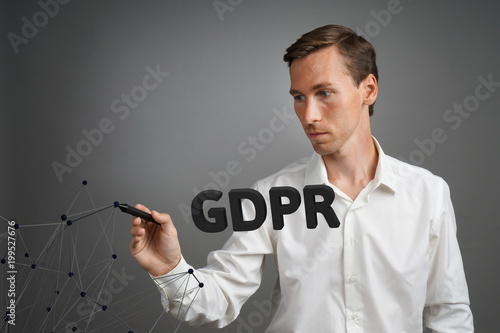 GDPR concept image. General Data Protection Regulation, the protection of personal data in European Union. Young man working with information.