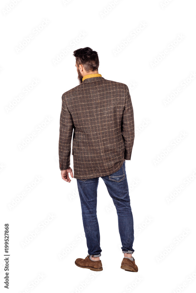 Naklejka premium Handsome young man with beard full height standing against white background.