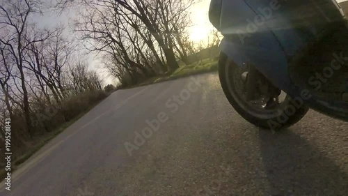 Scooter ride to sunset on open road