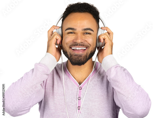 Portrait of a cheerful young afro american man listening to music with headphones
