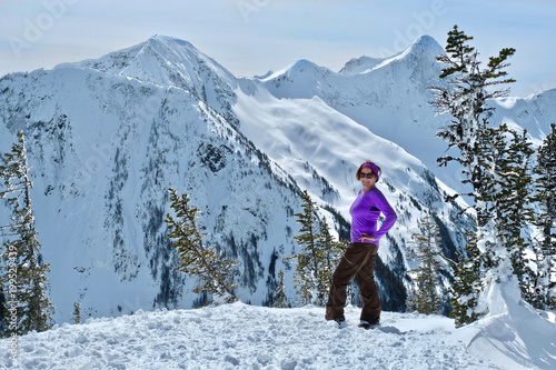 Senior woman snowshoeing in mountains near Vancouver. Coquihalla summit near Harrison Hot Springs resort.  British Columbia. Canada. photo