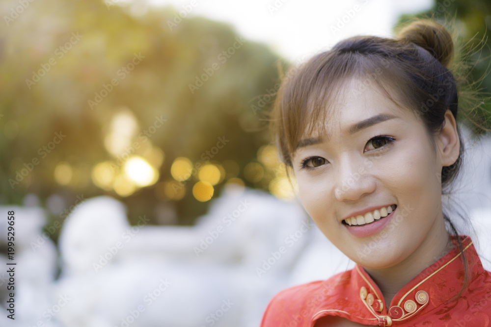 Interesting Chinese women in dresses. She looks happy and bright smile. Interesting Chinese women in dresses. She looks happy and bright smile.