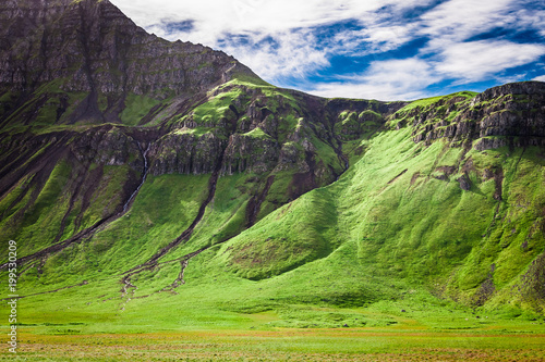Green mountains and blue sk...