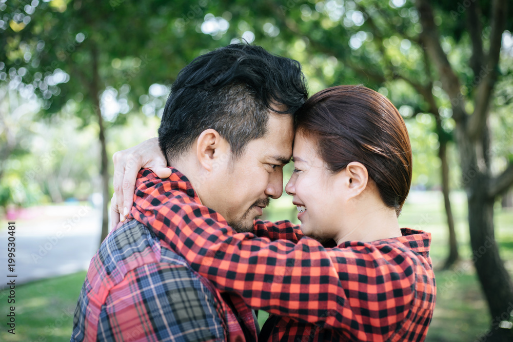 Happy to be together. beautiful young loving couple standing outdoors Happy to be together. beautiful young loving couple standing outdoors