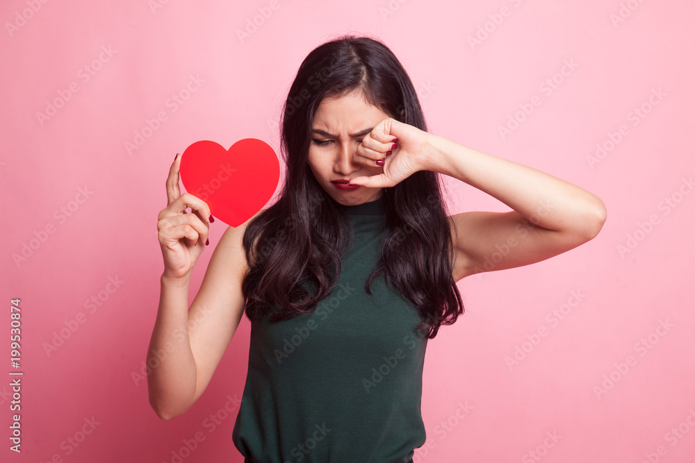 Asian woman sad and cry with red heart. Asian woman sad and cry with red heart.
