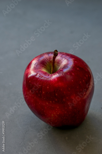 Red apple on a gray background