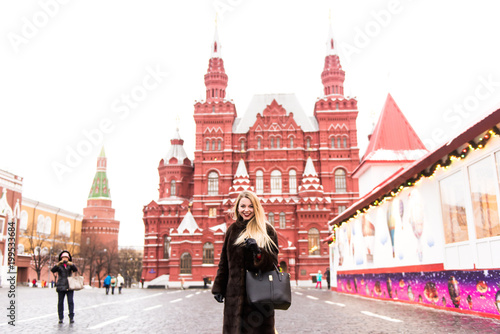 Photography Portrait in full growth, Russian beautiful woman in a mink coat on the Red Squar