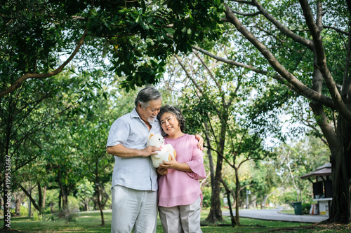 Happy senior couple in the park © Johnstocker