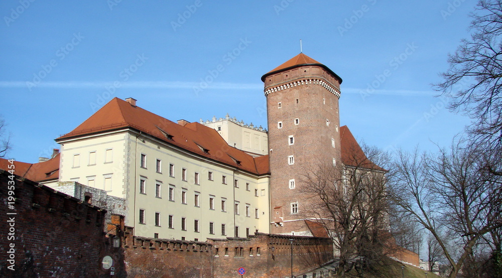 Panorama of the ancient castle in the historic district of Krakow on the background of the blue sky.