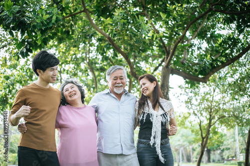 happy family walking outdoor in the park