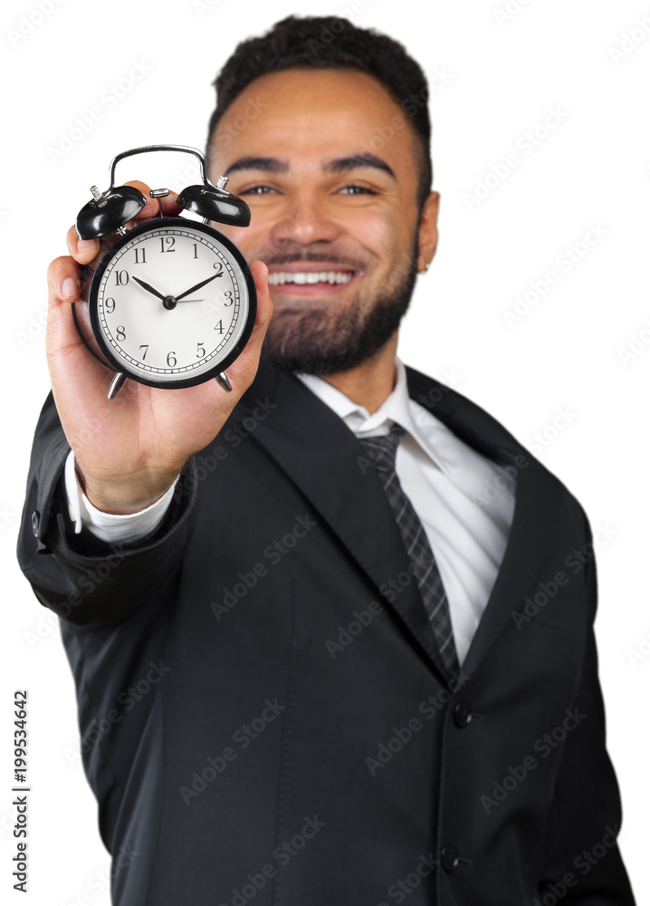 Young businessman holding alarm clock isolated on white Young businessman holding alarm clock isolated on white
