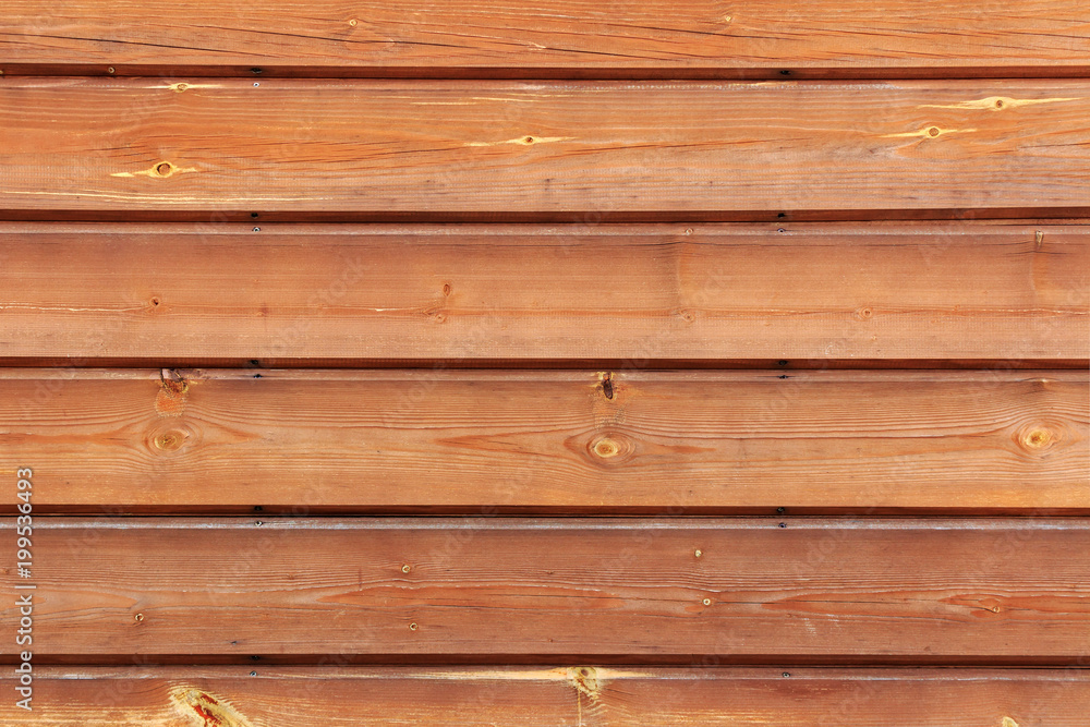 Fototapeta premium Brown lacquered wooden planks closeup. Natural wooden texture