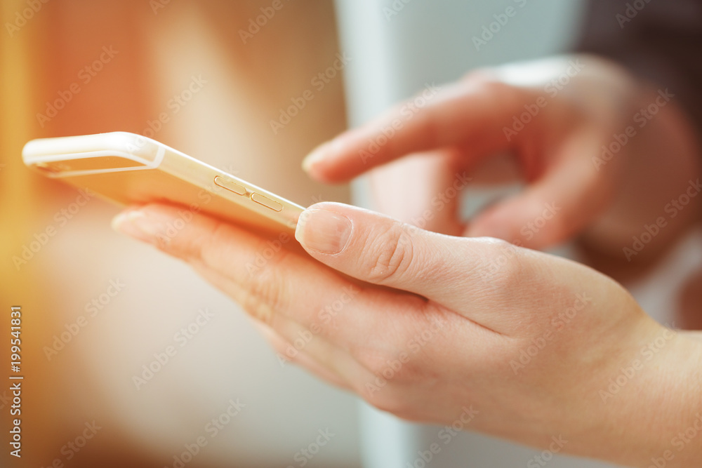 Woman typing write message on smart phone Woman typing write message on smart phone