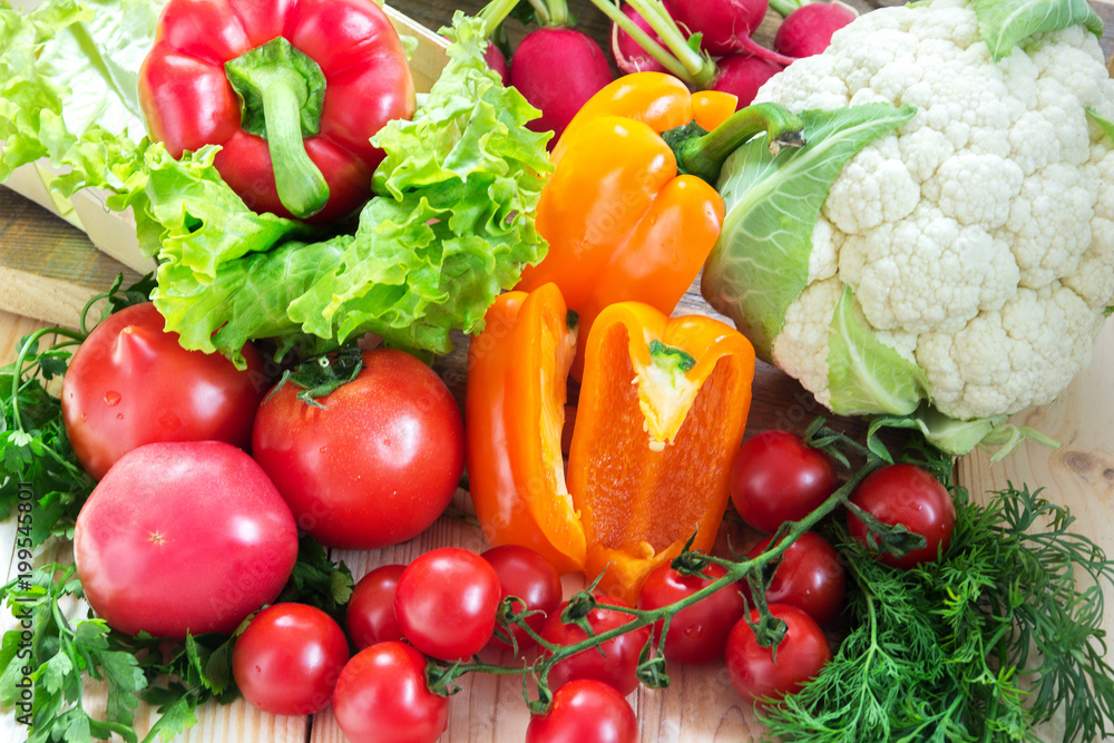 Different vegetables as a tomatoes, cauliflower, peppers and cherry tomatoes Different vegetables as a tomatoes, cauliflower, peppers and cherry tomatoes
