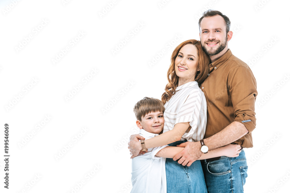 happy parents with adorable little son hugging and smiling at camera isolated on white happy parents with adorable little son hugging and smiling at camera isolated on white