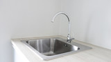 stainless steel with water drop on sink.