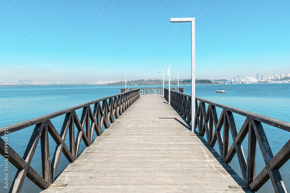Wooden scaffolding with lake and city background