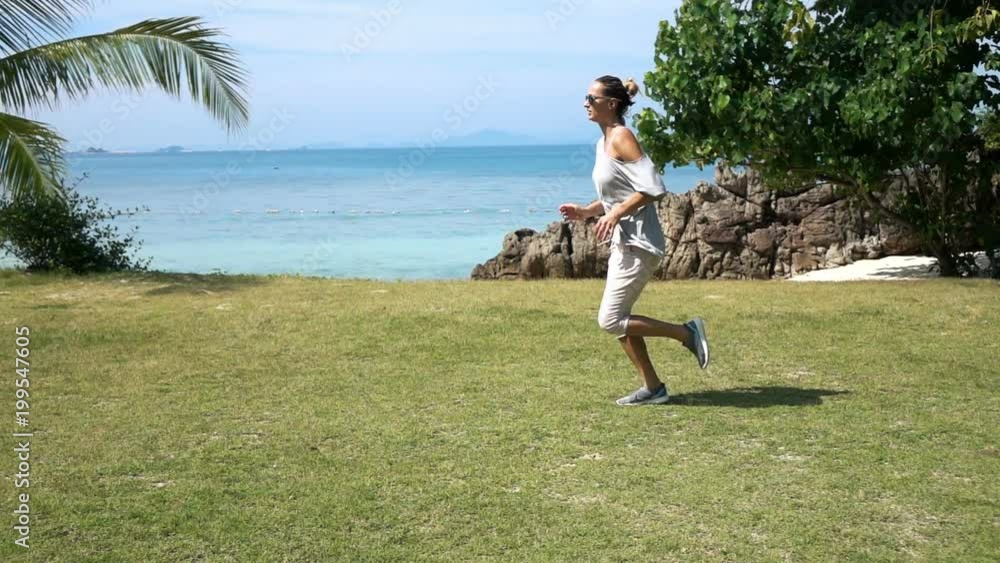 Young, sporty woman jogging in garden, super slow motion 240fps
Young, sporty woman jogging in garden, super slow motion 240fps