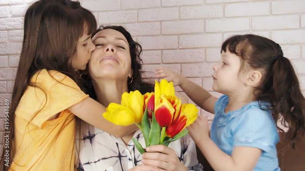 Give flowers. Daughters give flowers to mother. Give flowers. Daughters give flowers to mother.