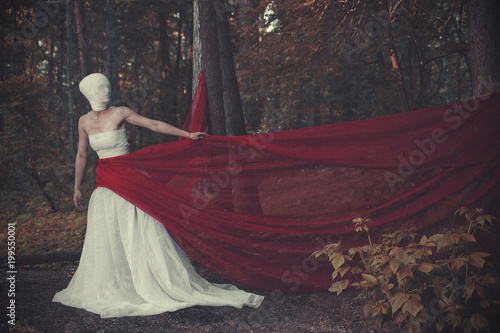 The young model is posing with a surreal character