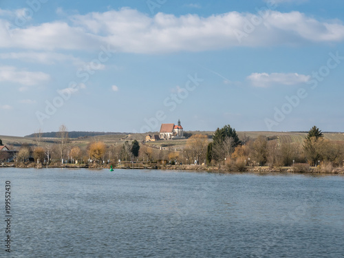 Landscape view over the river to a church