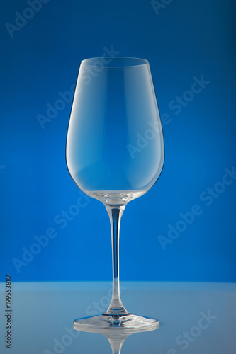 empty wineglass/ empty wineglass on blue background