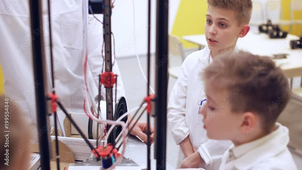 Lesson in school with 3D printing. Modern education theme Lesson in school with 3D printing. Modern education theme