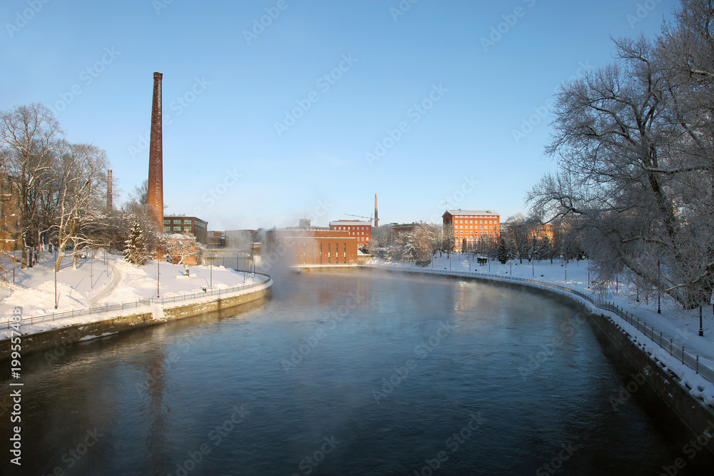 Obraz premium View of Old factory and river Tammerkoski in Tampere CIty Center in winter