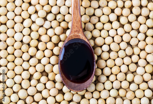 Soy sauce with soybeans background