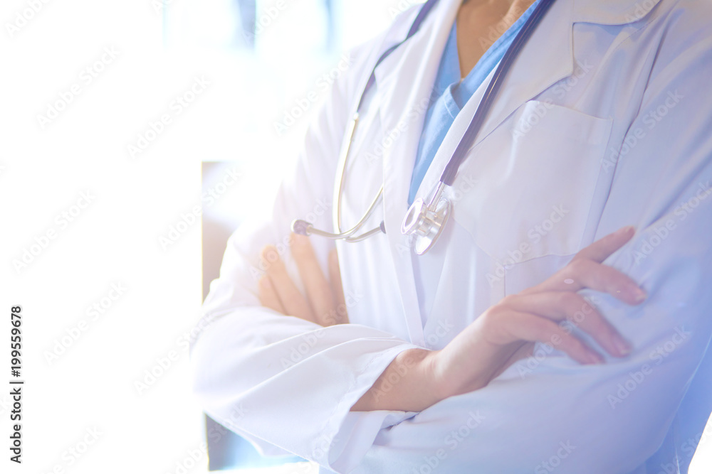 Image of attractive woman doctor looking at x-ray results. Image of attractive woman doctor looking at x-ray results.