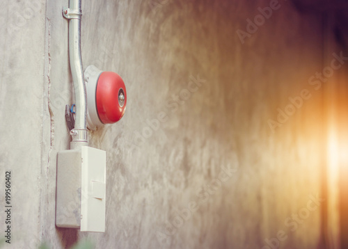 Close up of Fire alarm bell on wall in hostel, Safety first concept. photo