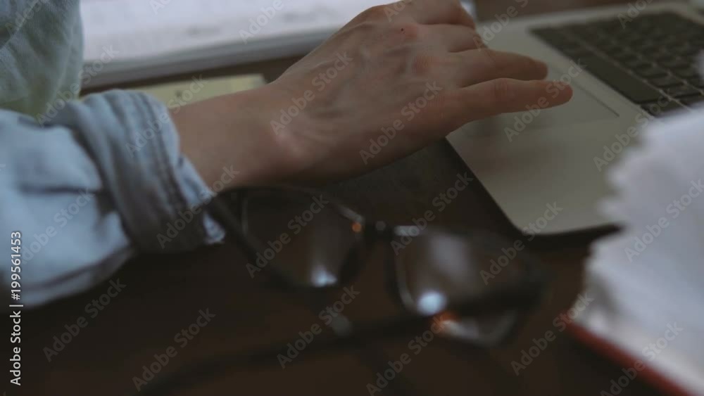 Freelancer works remotely over the Internet on his computer sitting in the home office Freelancer works remotely over the Internet on his computer sitting in the home office