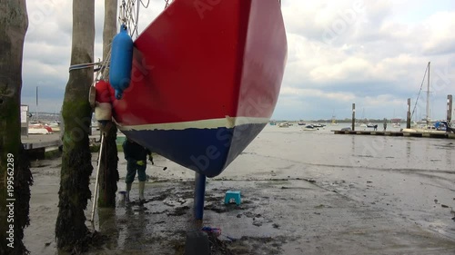 Antifouling a boat scraping and jet washing