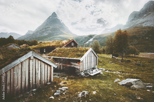 Innerdalen Mountains valley Landscape and traditional norwegian houses grass roofs farm village in Norway Travel scenery scandinavian wooden architecture photo