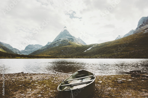 Innerdalen Mountains, lake and boat  Landscape in Norway Travel scenery scandinavian nature photo