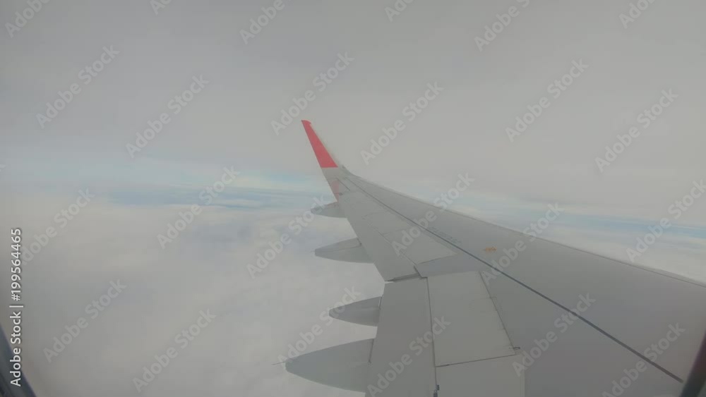 Clouds seen through the window of jet airplane go pro Clouds seen through the window of jet airplane go pro