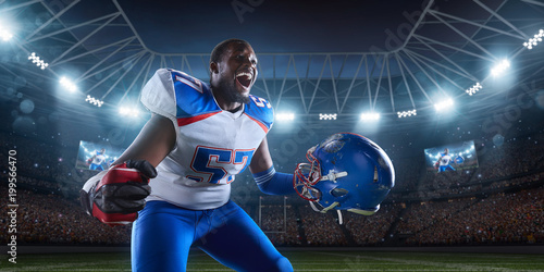 American football player emotionally rejoices in victory in professional sport stadium