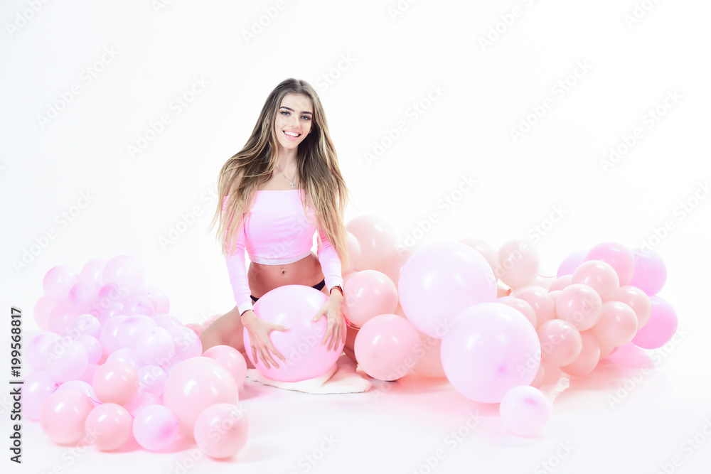 Trendy young woman posing in pink balloons. Party girl, happy mood, celebration concept. Girl in pink shirt sits with balloons. Sexy girl with long hair posing with balloons. Party mood. Trendy young woman posing in pink balloons. Party girl, happy mood, celebration concept. Girl in pink shirt sits with balloons. Sexy girl with long hair posing with balloons. Party mood.