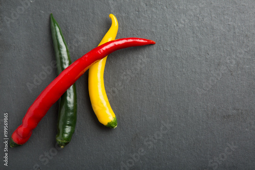 chili peppers on a slate stone slab