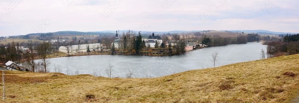Wide Angle Landscape Shot of a Basilica of the Assumption of the Virgin Mary and St. Nicholas and Konvent Pond near Zdar nad Sazavou Town. View Above from Hill at Zelena Hora.