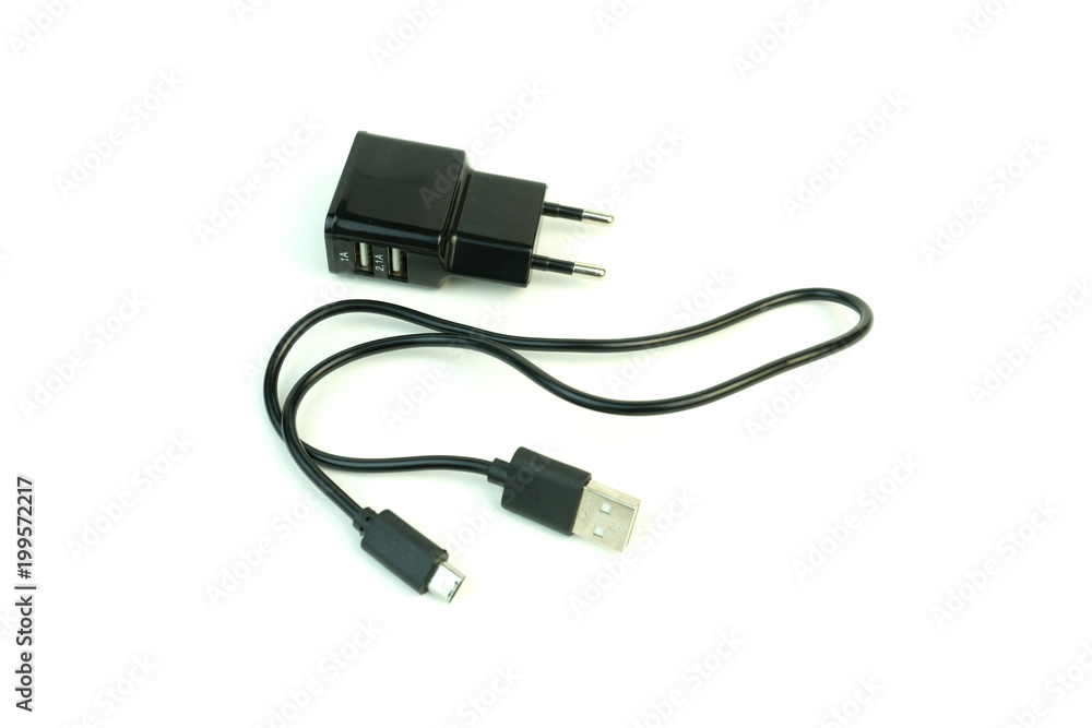 The charger for the phone. Photo on white background. The charger for the phone. Photo on white background.