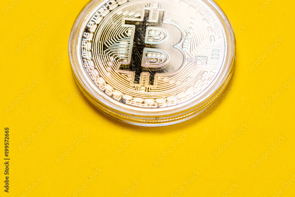 Golden bitcoin on yellow background. New virtual money. Bitcoin processor and microchips. Electronic currency, Internet Finance Golden bitcoin on yellow background. New virtual money. Bitcoin processor and microchips. Electronic currency, Internet Finance