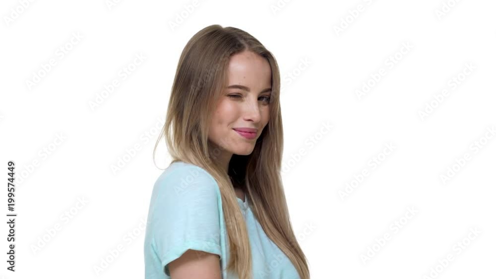Portrait of caucasian woman 20s wearing basic t-shirt posing with flirty seductive look, isolated over white background in studio. Concept of emotions Portrait of caucasian woman 20s wearing basic t-shirt posing with flirty seductive look, isolated over white background in studio. Concept of emotions
