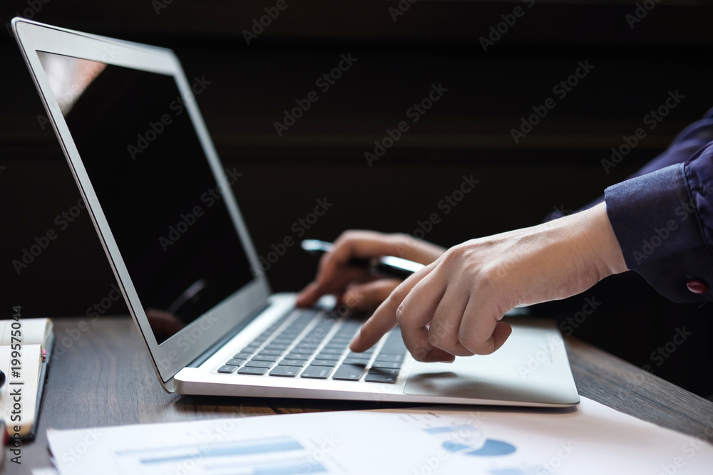 Professional business woman working on laptop, hand typing on keyboard Professional business woman working on laptop, hand typing on keyboard