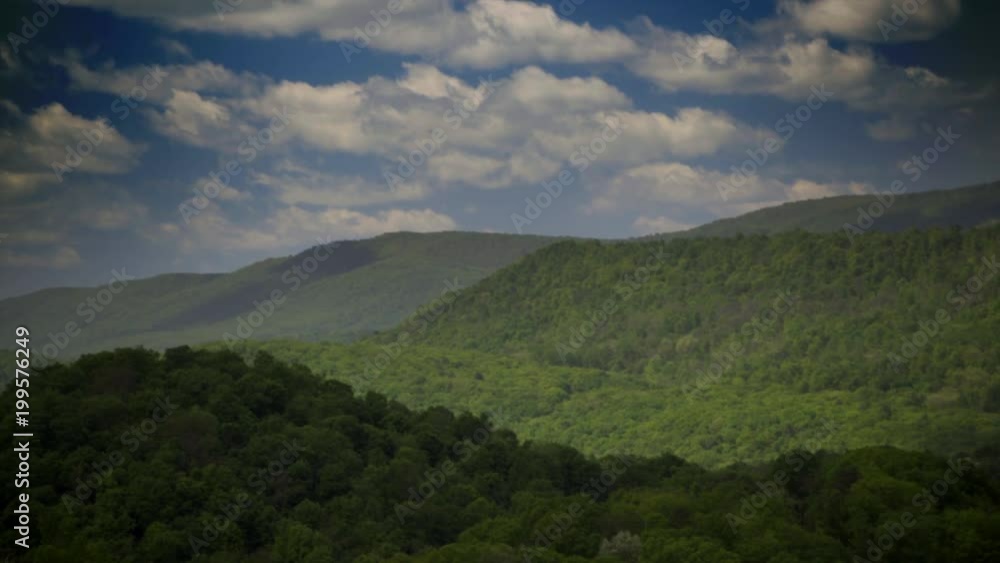 Beautiful view of spring in the Appalachian mountains of West Virginia and Maryland as clouds float over the landscape. Beautiful view of spring in the Appalachian mountains of West Virginia and Maryland as clouds float over the landscape.